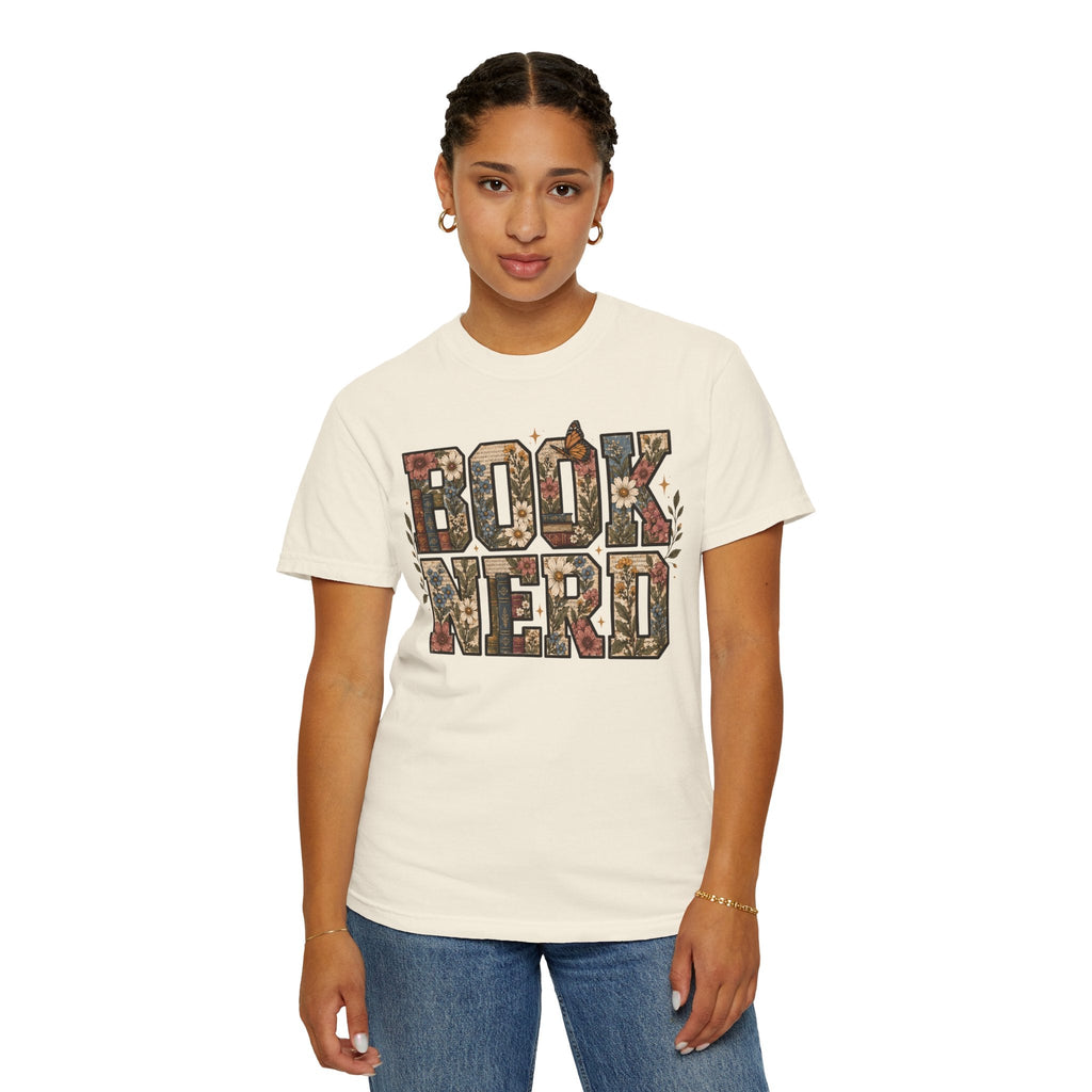 Wicked Thread Society cream graphic tee with floral BOOK NERD lettering worn by a woman with braided hair.