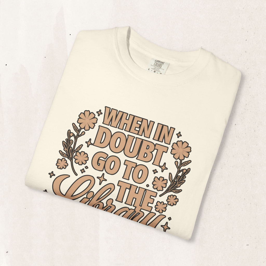 Wicked Thread Society cream cotton graphic tee with When in Doubt Go to the Library text and floral illustrations.