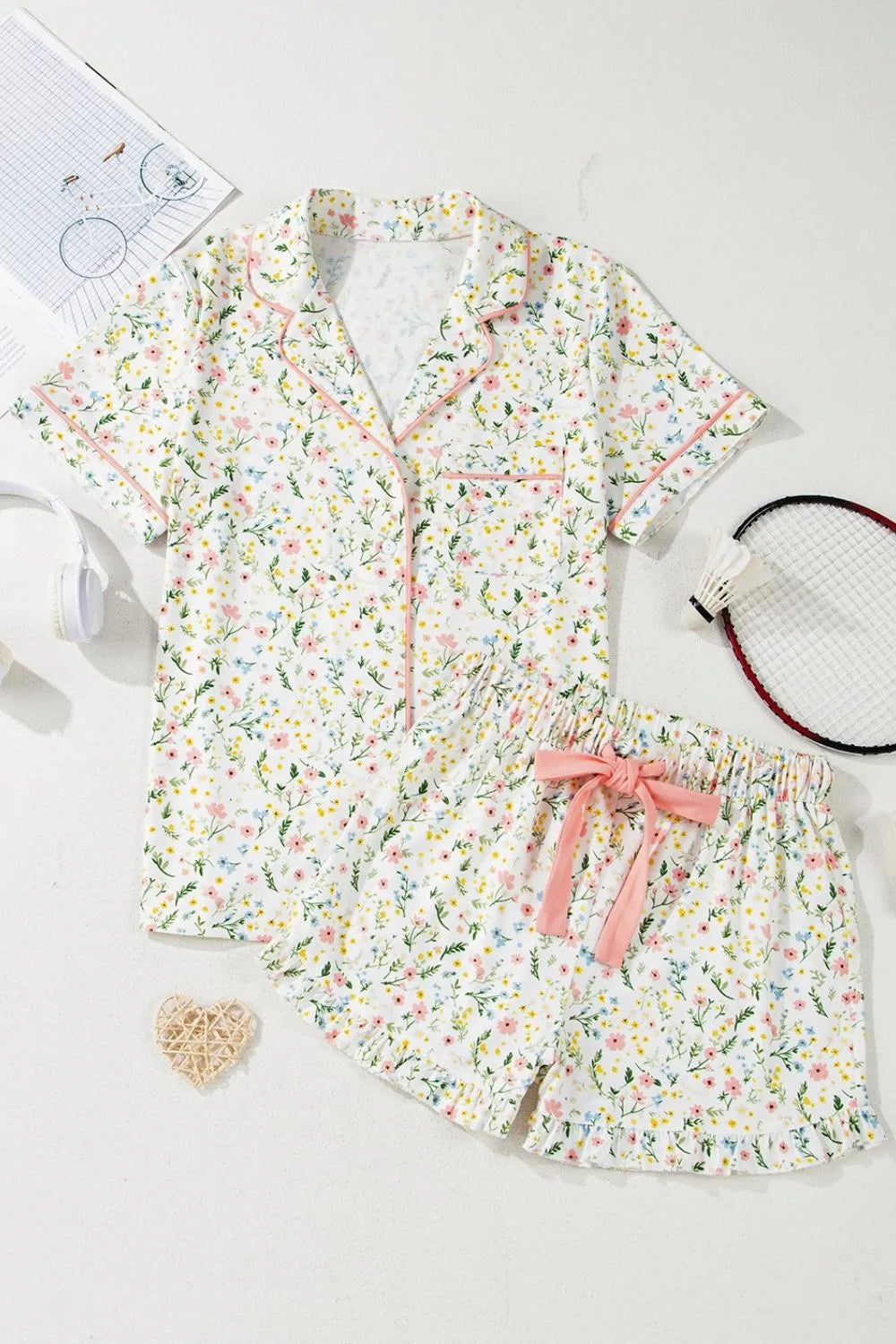 Wicked Thread Society floral print button-up lounge set with short sleeves, drawstring shorts, and pink trim details.
