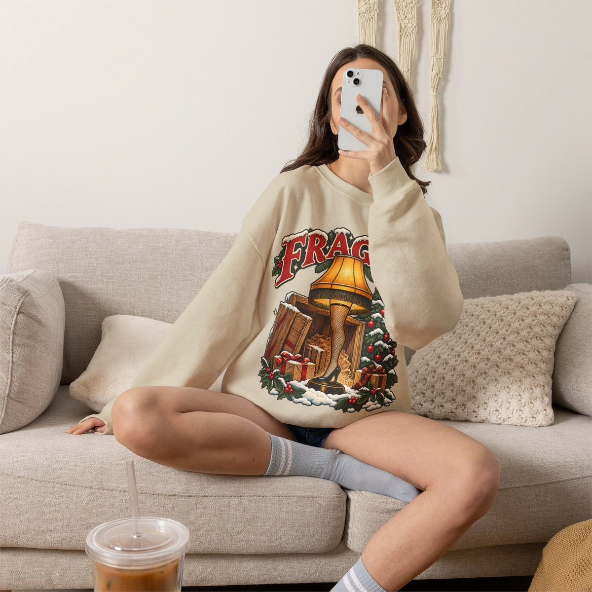 Wicked Thread Society crewneck sweatshirt featuring a vintage A Christmas Story leg lamp graphic on a cream base.