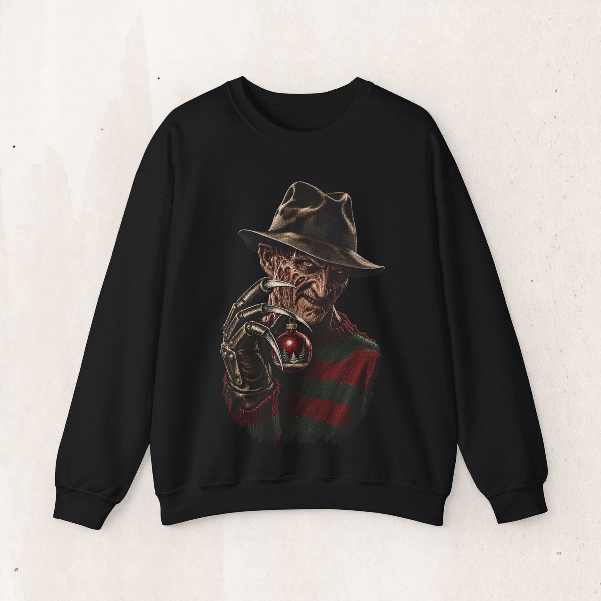 Wicked Thread Society black crewneck sweatshirt featuring a detailed graphic of Freddy Krueger holding a Christmas ornament