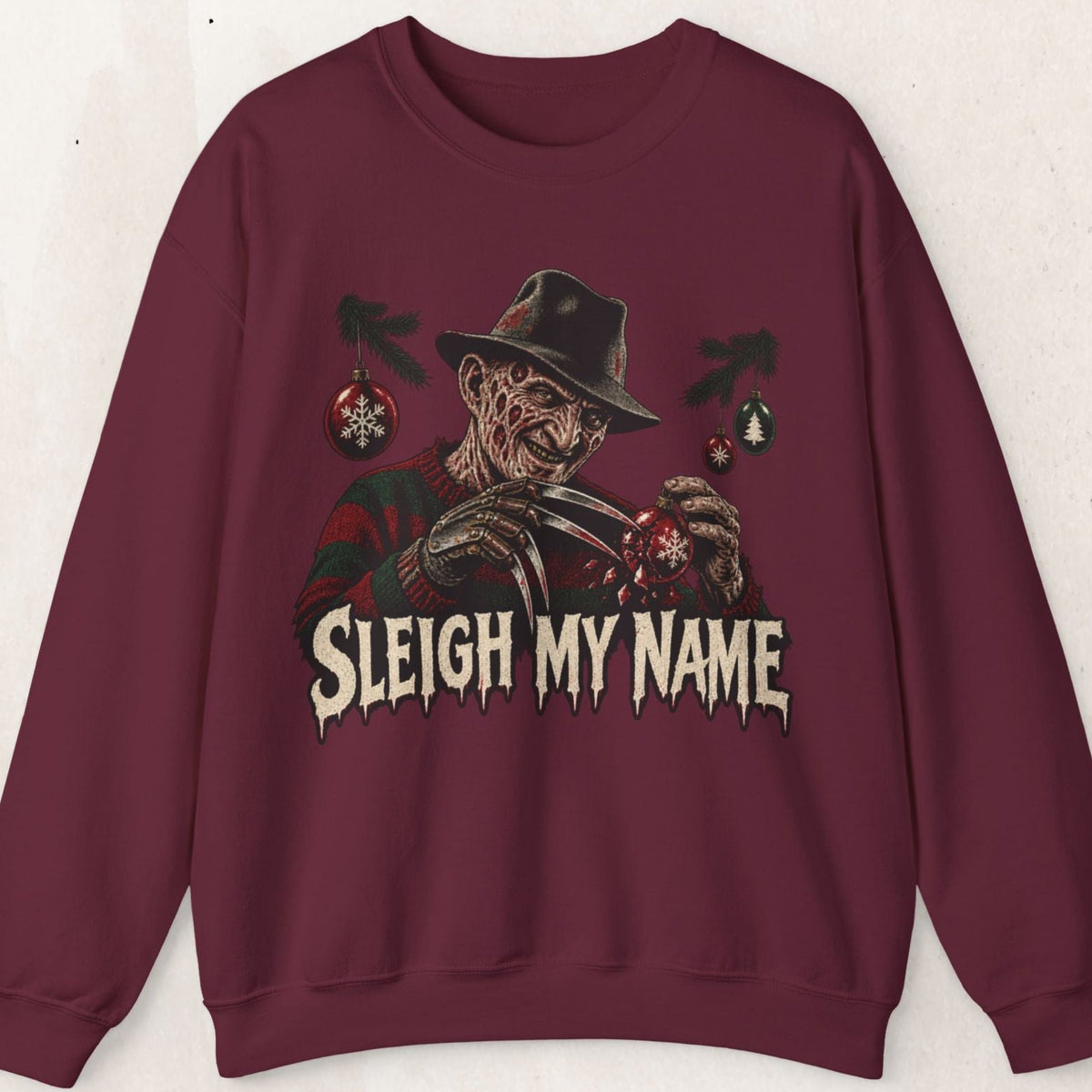 Wicked Thread Society maroon crewneck sweatshirt featuring a Freddy Krueger Christmas graphic and Sleigh My Name text.