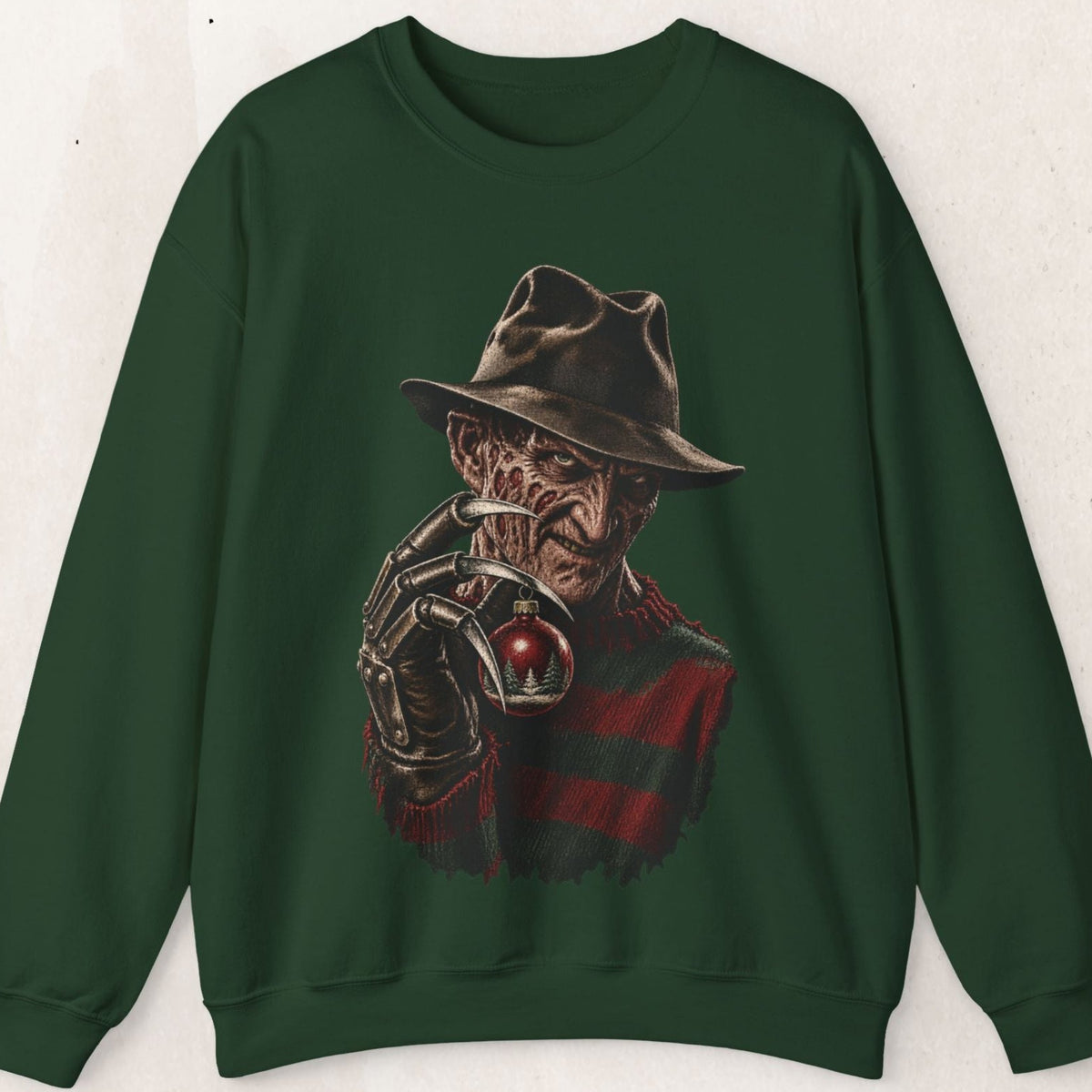 Wicked Thread Society dark green crewneck sweatshirt featuring a detailed graphic of Freddy Krueger holding a bauble