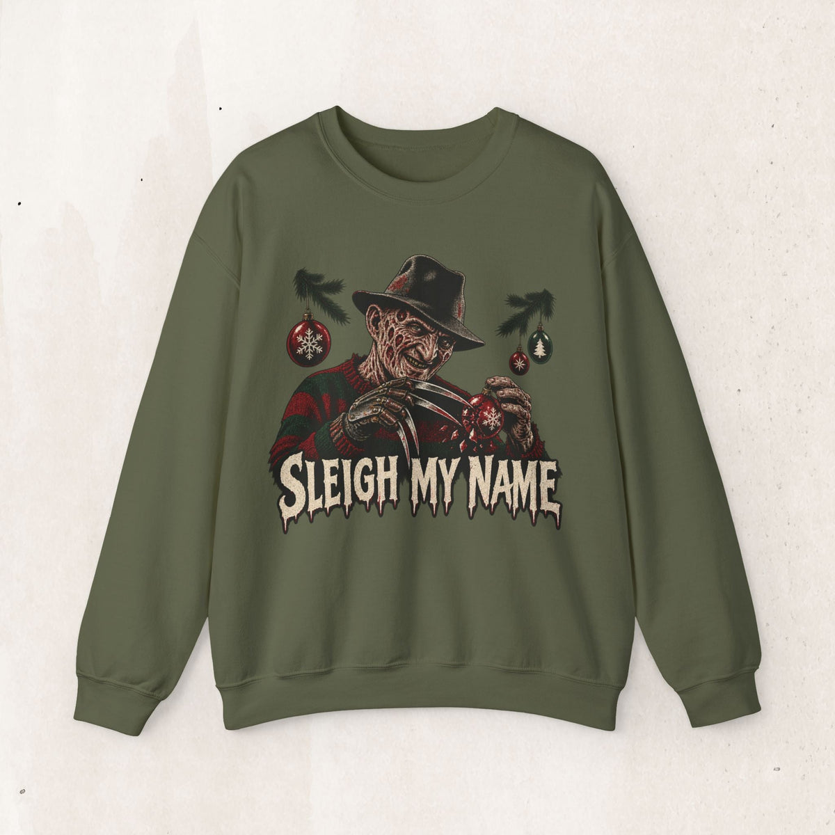 Wicked Thread Society olive green crewneck sweatshirt featuring a Freddy Krueger Christmas Sleigh My Name graphic.