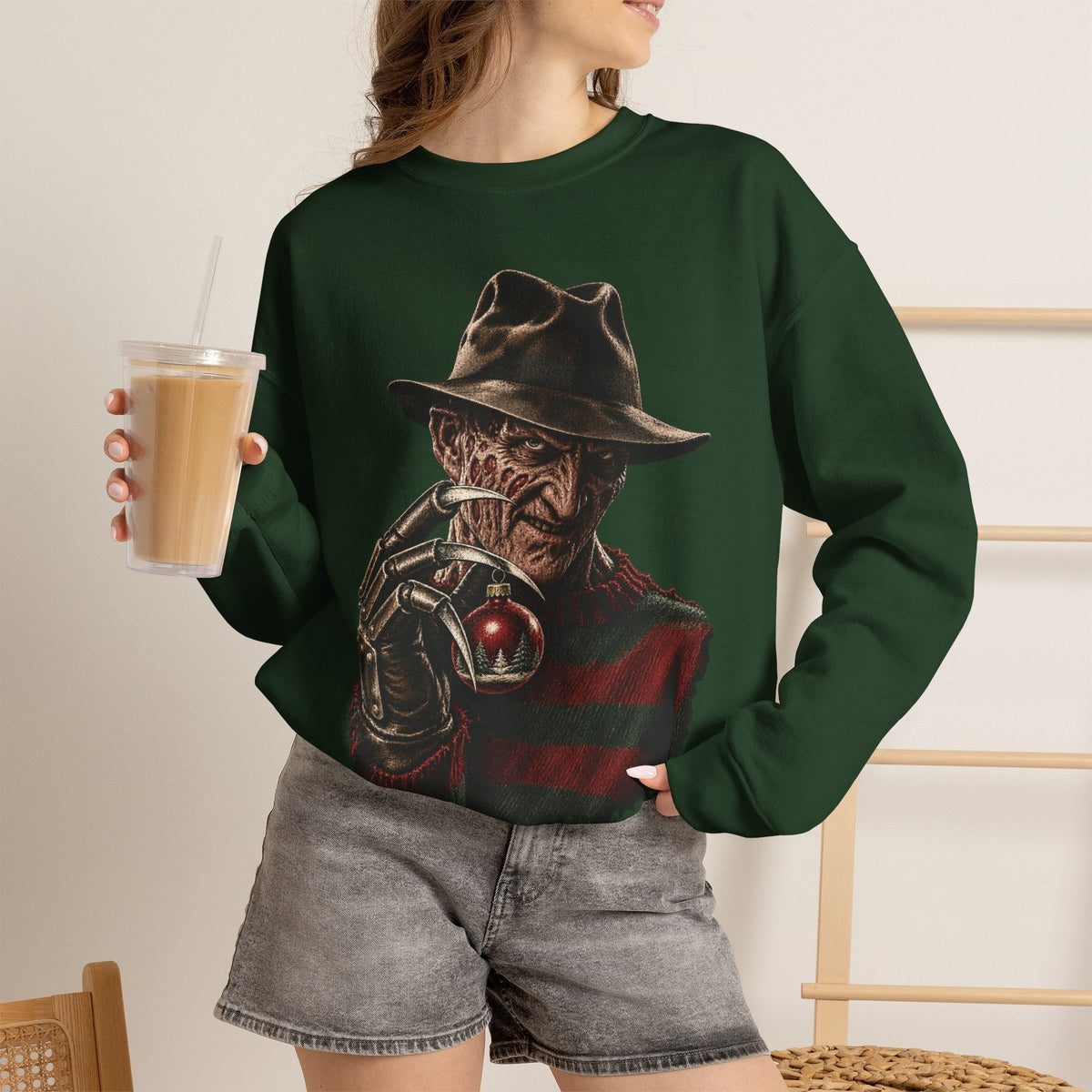 Wicked Thread Society dark green crewneck sweatshirt featuring a Freddy Krueger graphic holding a Christmas ornament