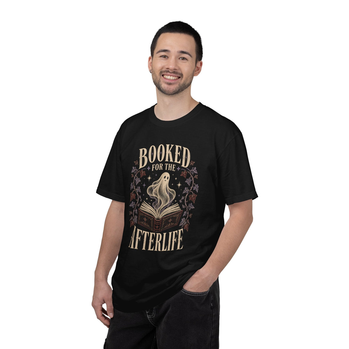 A man wearing a Wicked Thread Society black cotton tee with a vintage ghost and book graphic print.