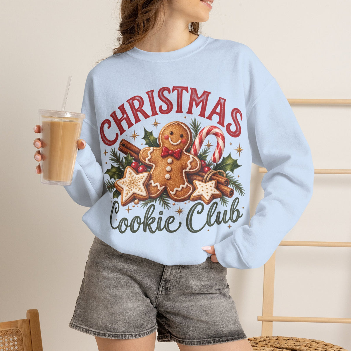 Wicked Thread Society light blue crewneck sweatshirt featuring a gingerbread man, candy canes, and holiday graphics.