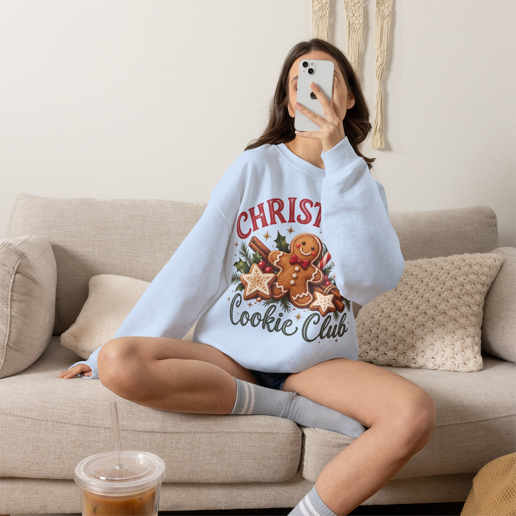 Wicked Thread Society light blue crewneck sweatshirt with a gingerbread man Christmas graphic worn by a woman