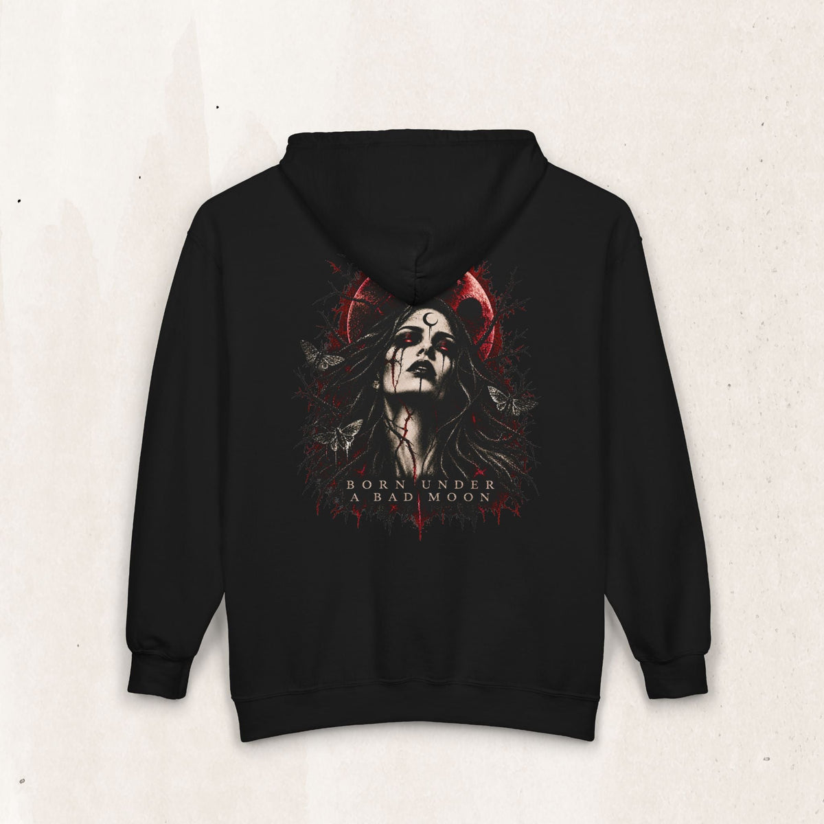 Wicked Thread Society black zip-up hoodie featuring a gothic Born Under A Bad Moon graphic with a crimson lunar print.
