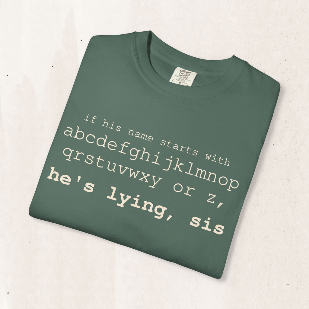 He's Lying, Sis T-shirt | Typographic alphabet humor tee Printify