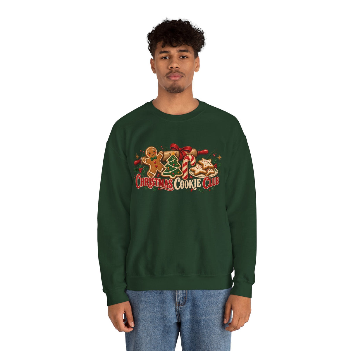 A man wearing a dark green Wicked Thread Society crewneck sweatshirt with a festive Christmas Cookie Club graphic.