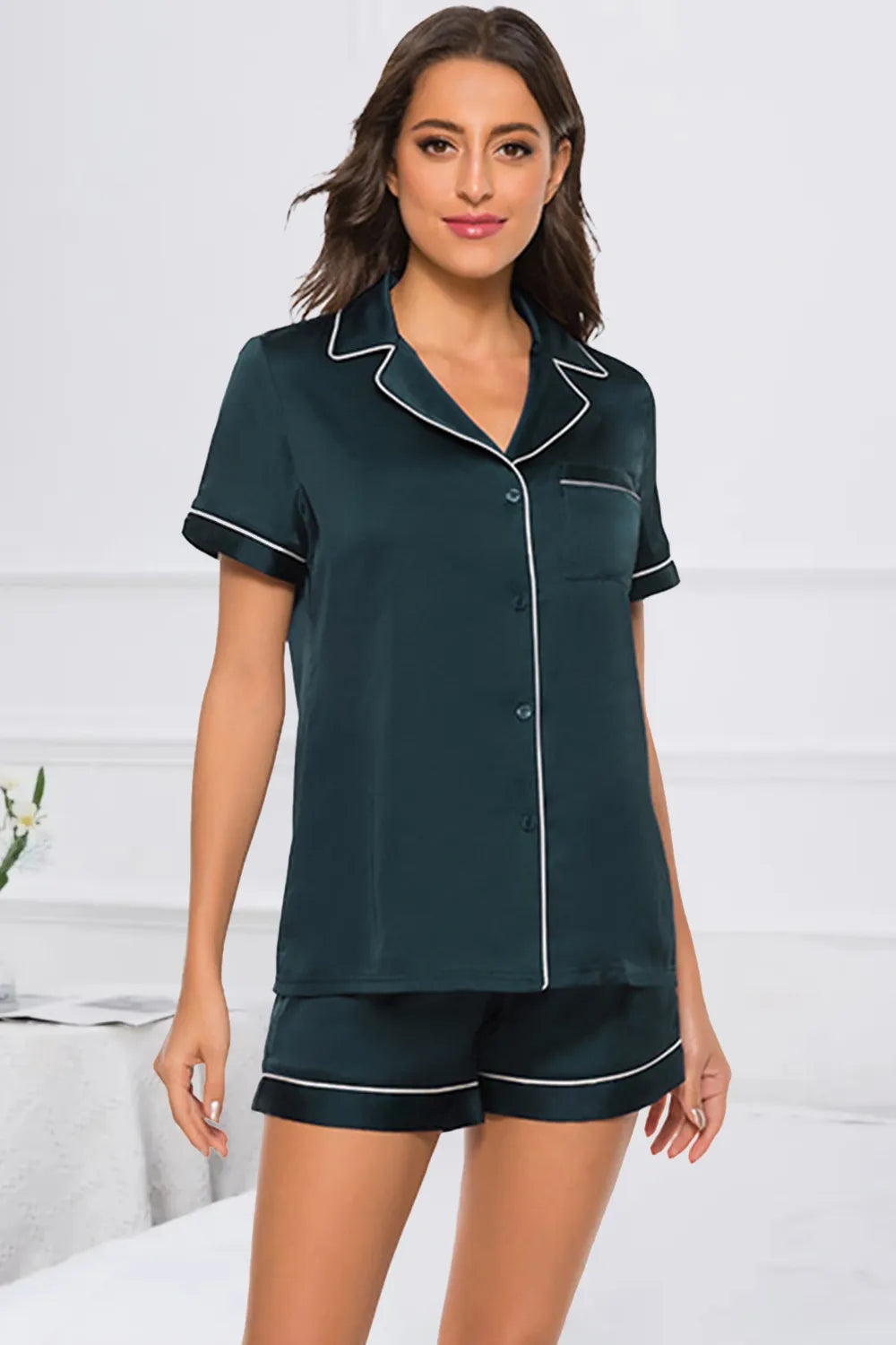 Wicked Thread Society dark green button-up pajama set with white piping, featuring short sleeves and matching shorts.