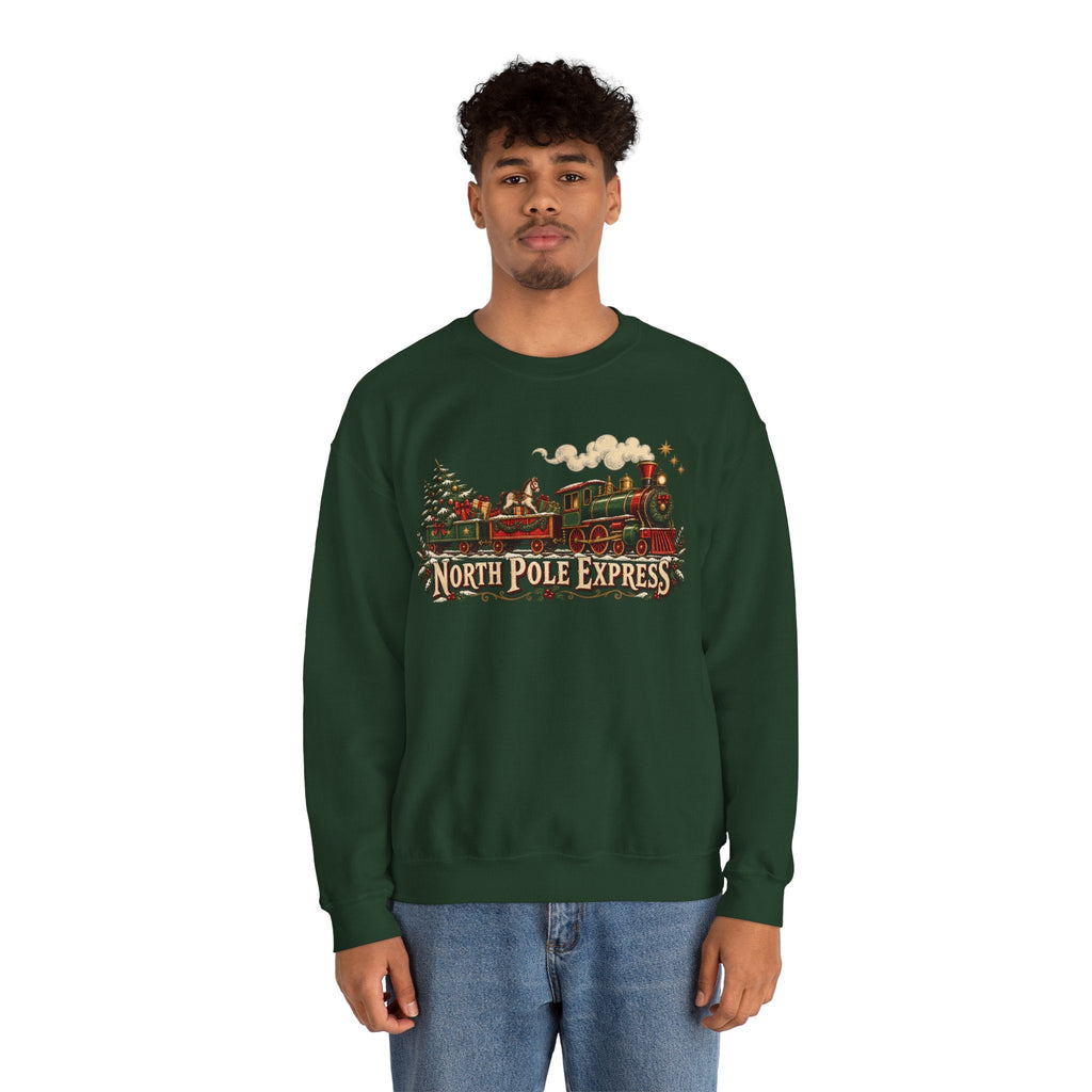 A man wearing a dark green Wicked Thread Society crewneck sweatshirt with a vintage North Pole Express train graphic.