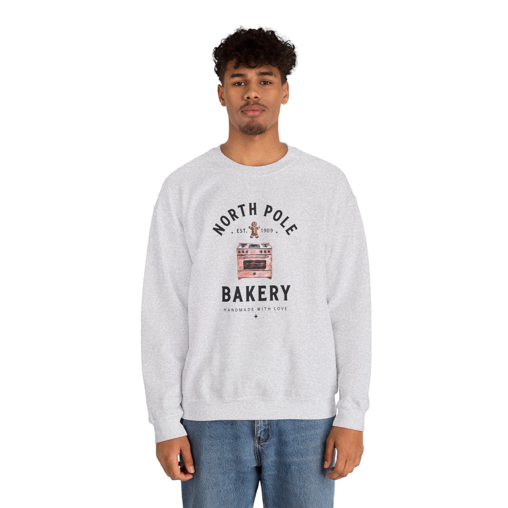 Wicked Thread Society grey crewneck sweatshirt with North Pole Bakery oven and gingerbread man graphic on a man