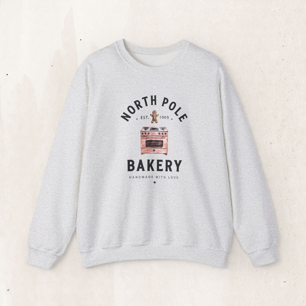Wicked Thread Society grey crewneck sweatshirt featuring a vintage North Pole Bakery oven and gingerbread man graphic.