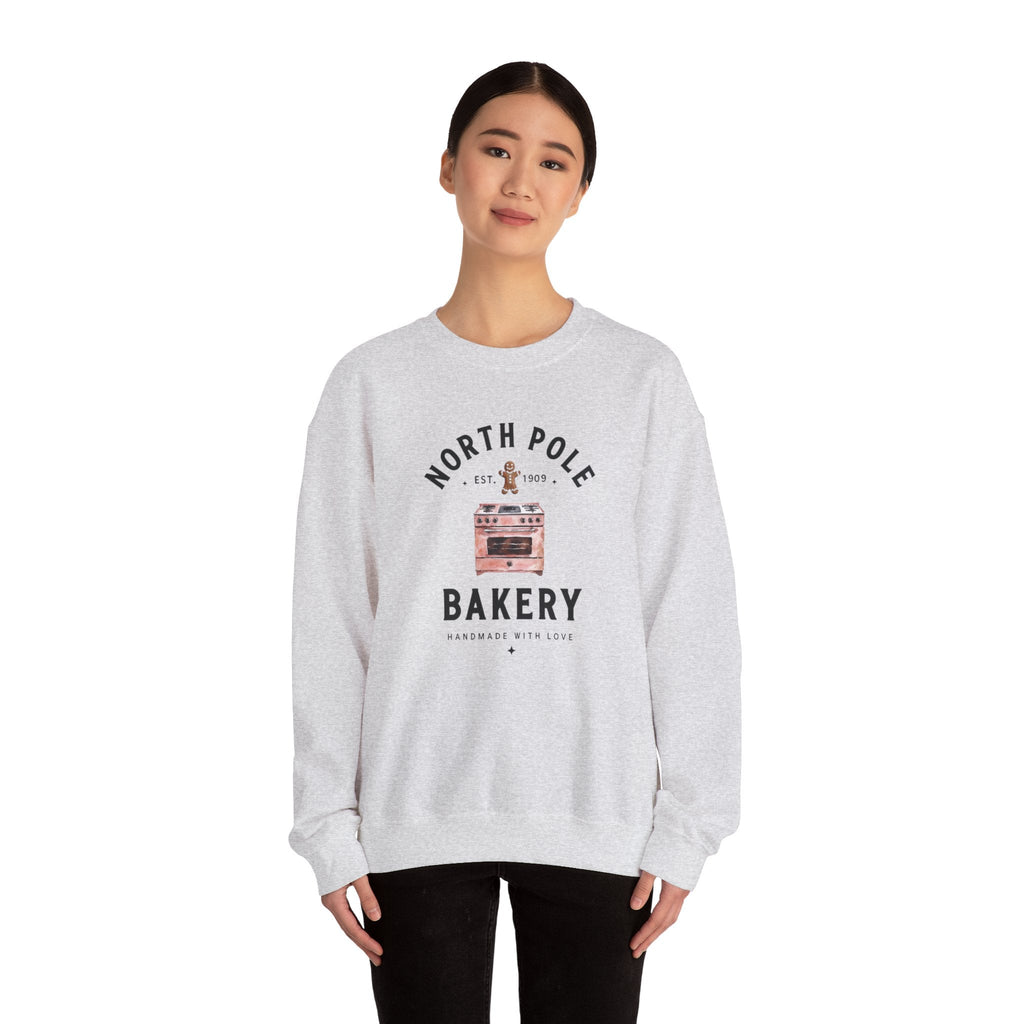 Wicked Thread Society grey crewneck sweatshirt with a vintage North Pole Bakery oven and gingerbread man graphic.