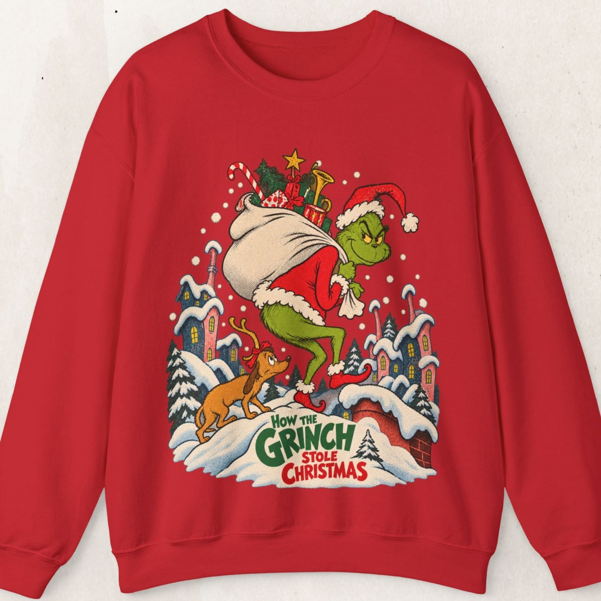 Wicked Thread Society red crewneck sweatshirt featuring a vintage Grinch illustration with Max on a snowy rooftop.