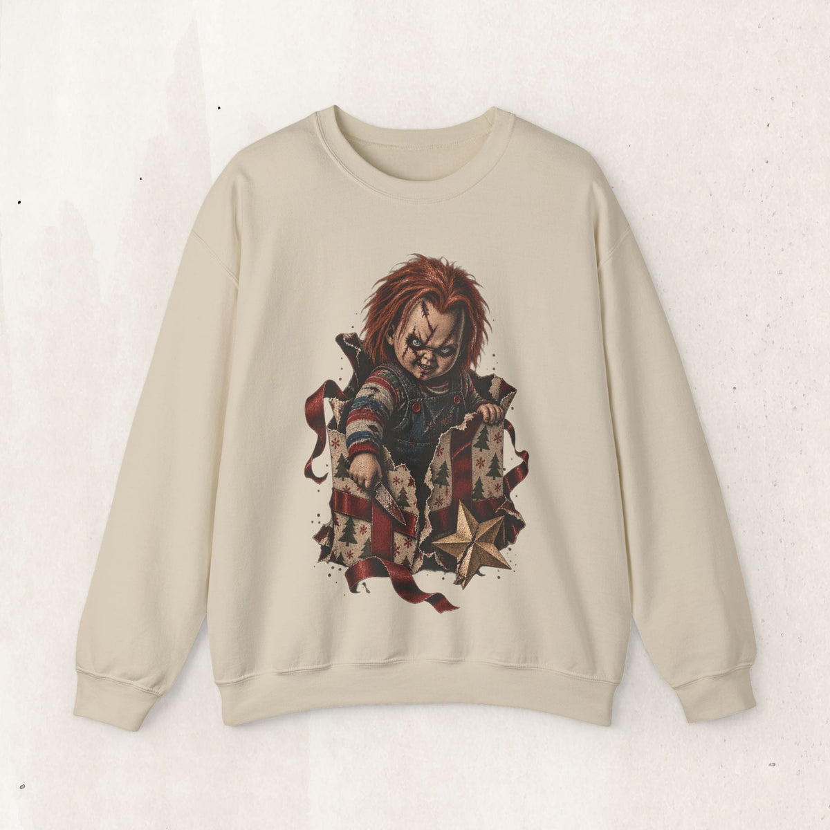 Wicked Thread Society beige crewneck sweatshirt featuring a horror doll graphic emerging from a holiday gift box.