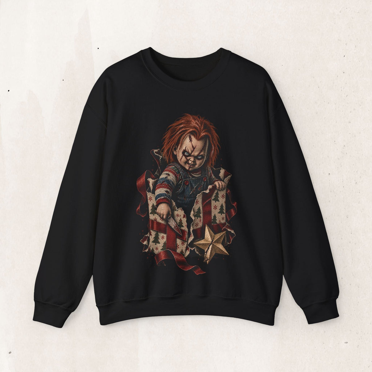 Wicked Thread Society black crewneck sweatshirt featuring a horror doll graphic bursting out of a Christmas gift box.