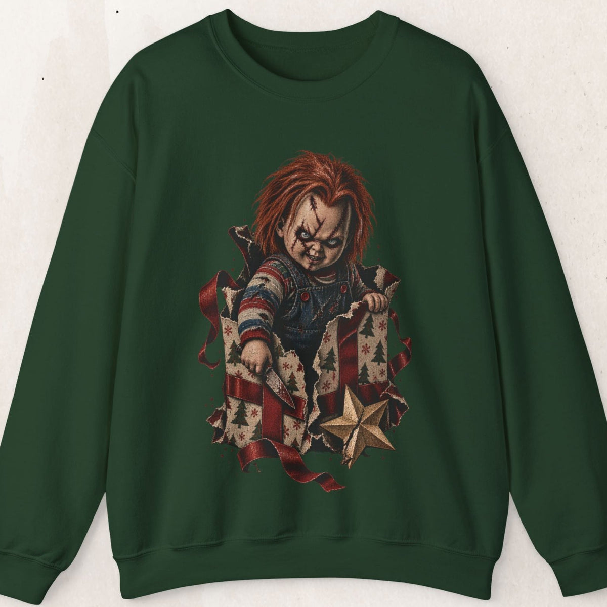 Wicked Thread Society dark green crewneck sweatshirt featuring a horror doll graphic bursting from a holiday gift box.