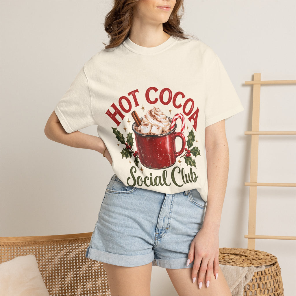 Wicked Thread Society cream graphic t-shirt with a festive hot cocoa mug print worn by a woman with denim shorts.
