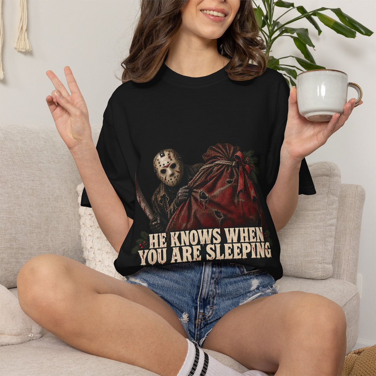 Wicked Thread Society black cotton t-shirt with Jason Voorhees Christmas graphic and He Knows When You Are Sleeping