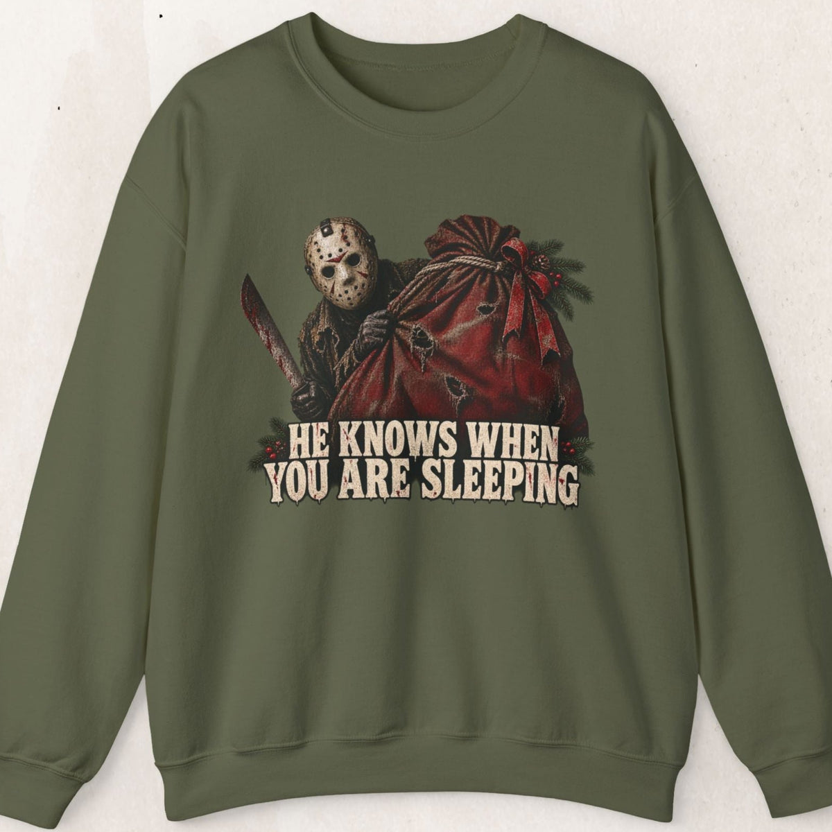 Wicked Thread Society olive green crewneck sweatshirt featuring a Jason Voorhees Christmas graphic and text.