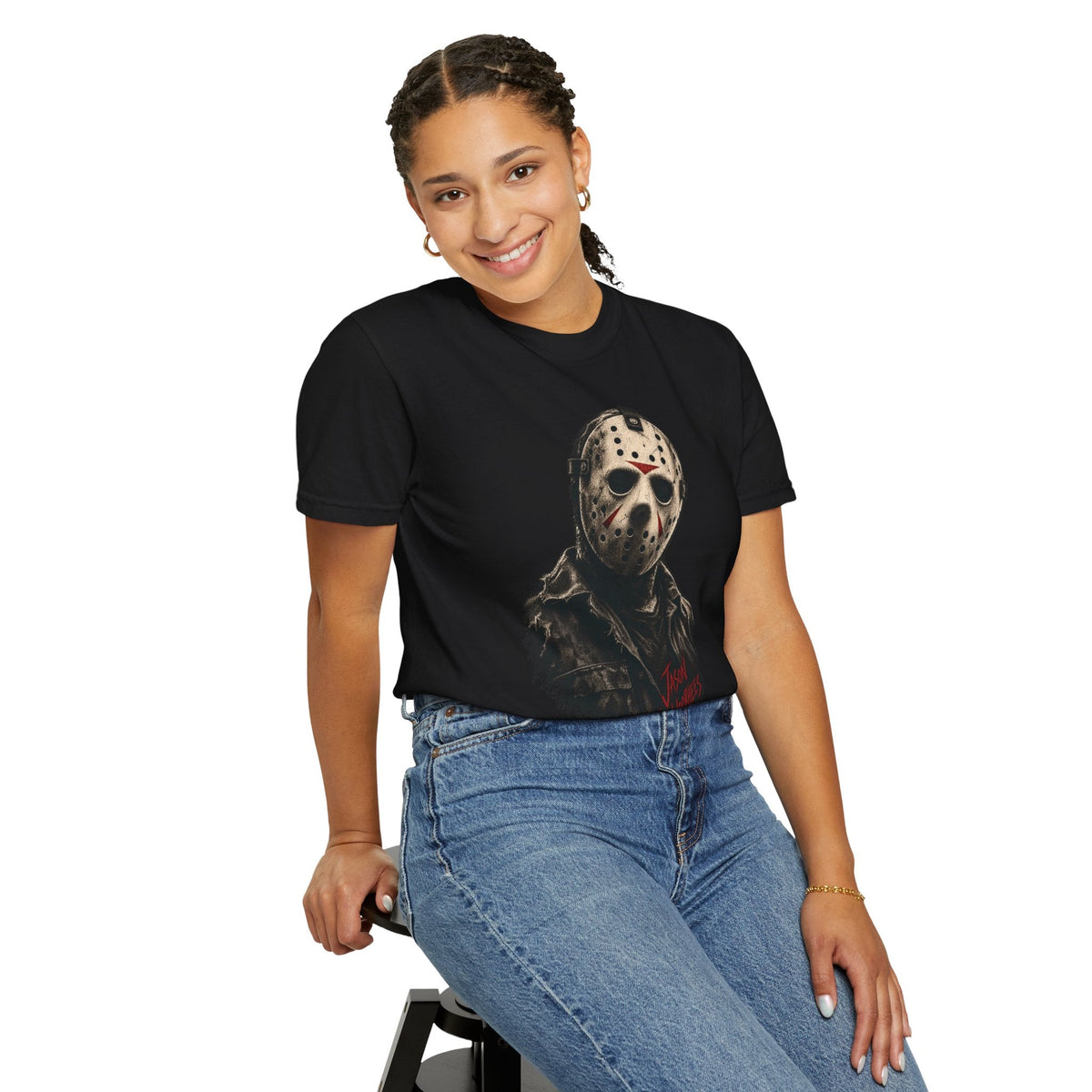 A woman wearing a Wicked Thread Society black graphic t-shirt featuring a detailed Jason Voorhees hockey mask print.