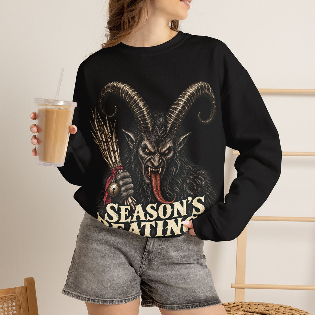 Wicked Thread Society black crewneck sweatshirt featuring a detailed Krampus graphic and Season's Beatings text.