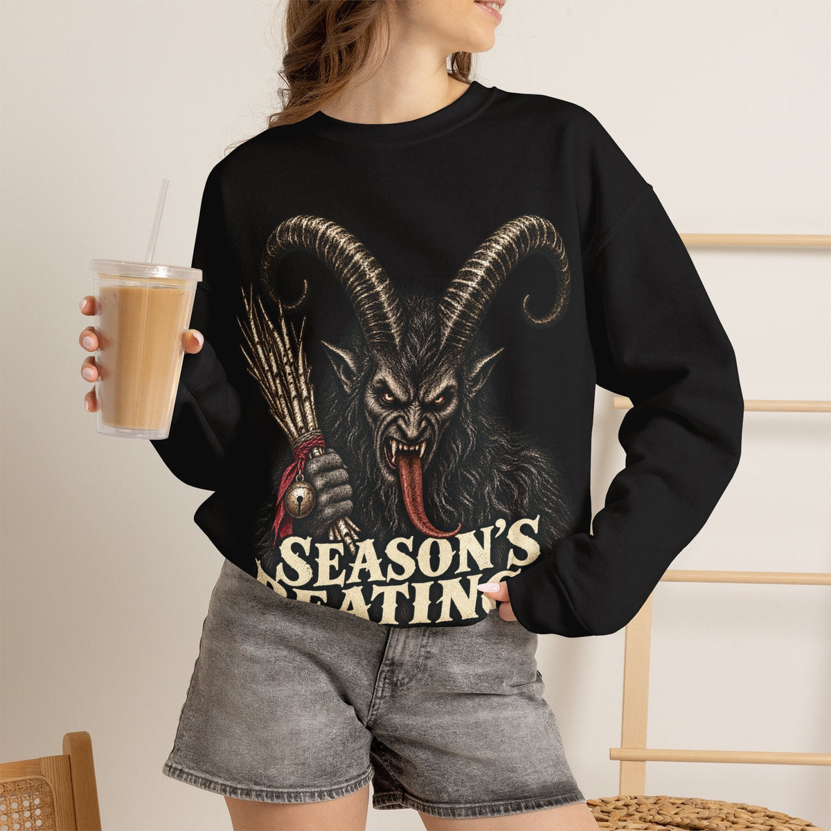 Wicked Thread Society black crewneck sweatshirt featuring a detailed Krampus graphic and Season's Beatings text.