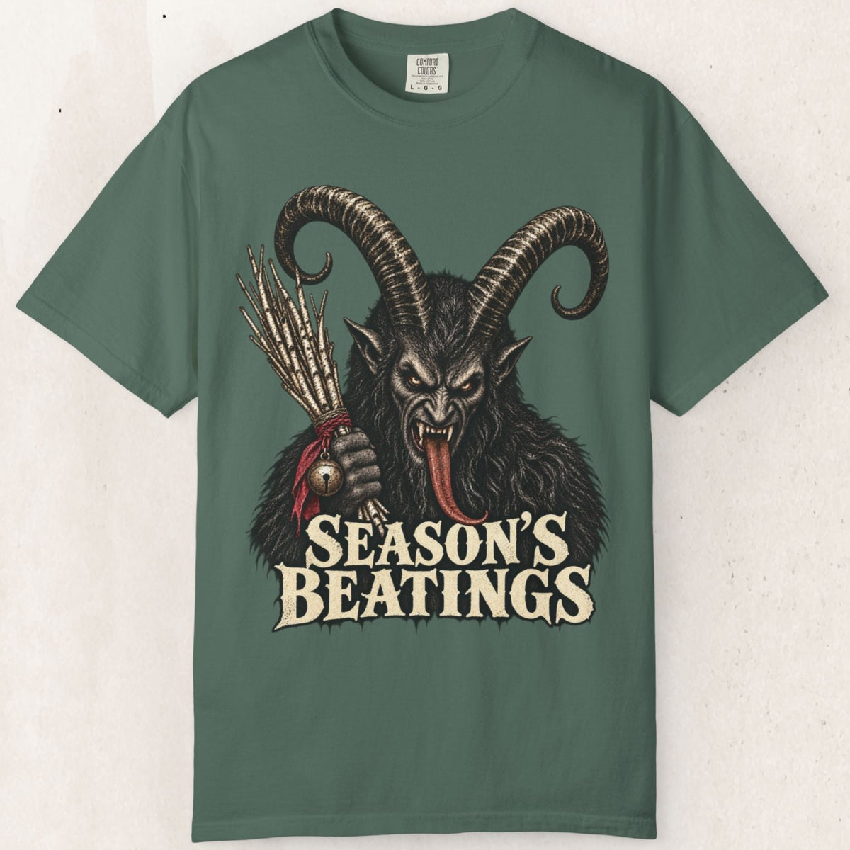 Wicked Thread Society dark green graphic t-shirt featuring a detailed Krampus illustration and Season's Beatings text.