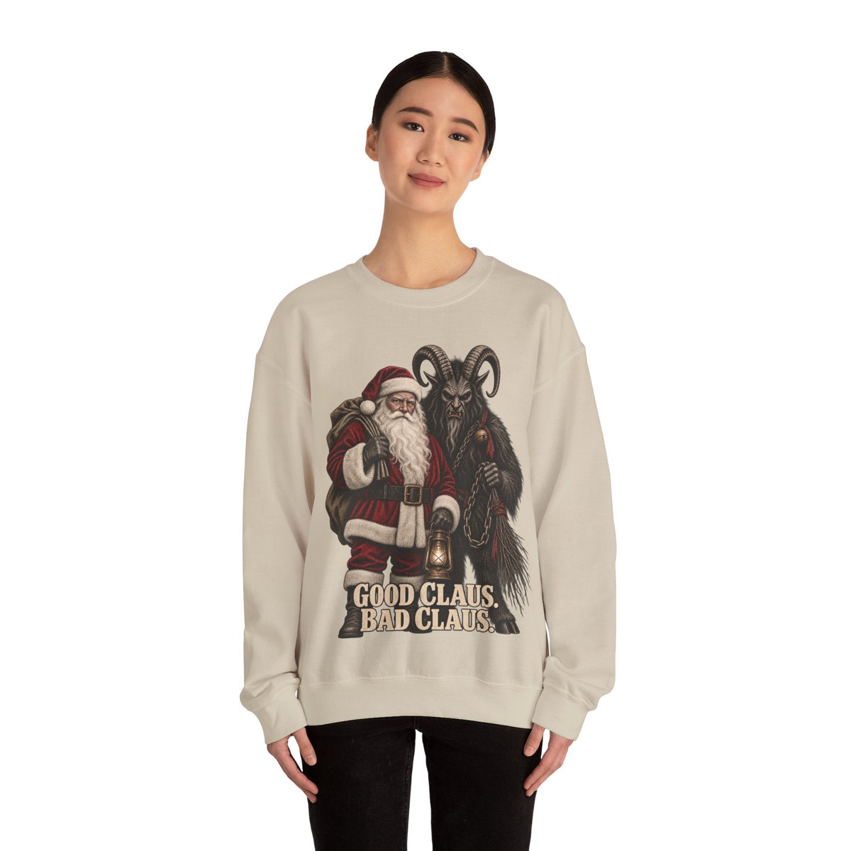 Wicked Thread Society beige crewneck sweater featuring a Krampus and Santa Claus graphic with Good Claus Bad Claus text