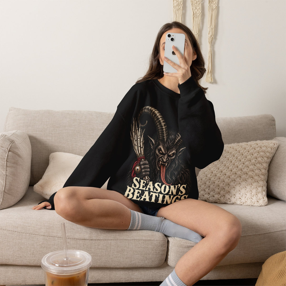 Wicked Thread Society black crewneck sweatshirt featuring a detailed Krampus graphic and Season's Beatings text.