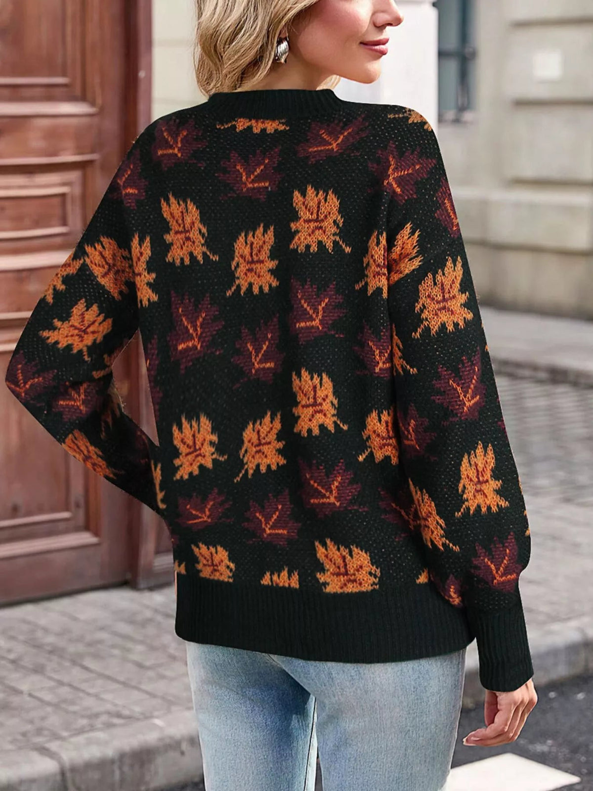 Wicked Thread Society mock neck sweater featuring a black base with an orange and red autumn leaf pattern