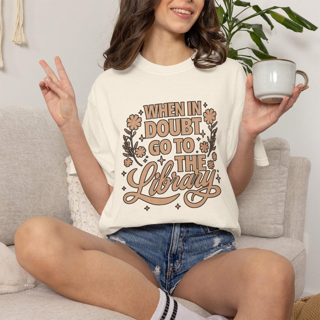 Wicked Thread Society cream cotton graphic tee with When in Doubt Go to the Library text, florals, and stars.