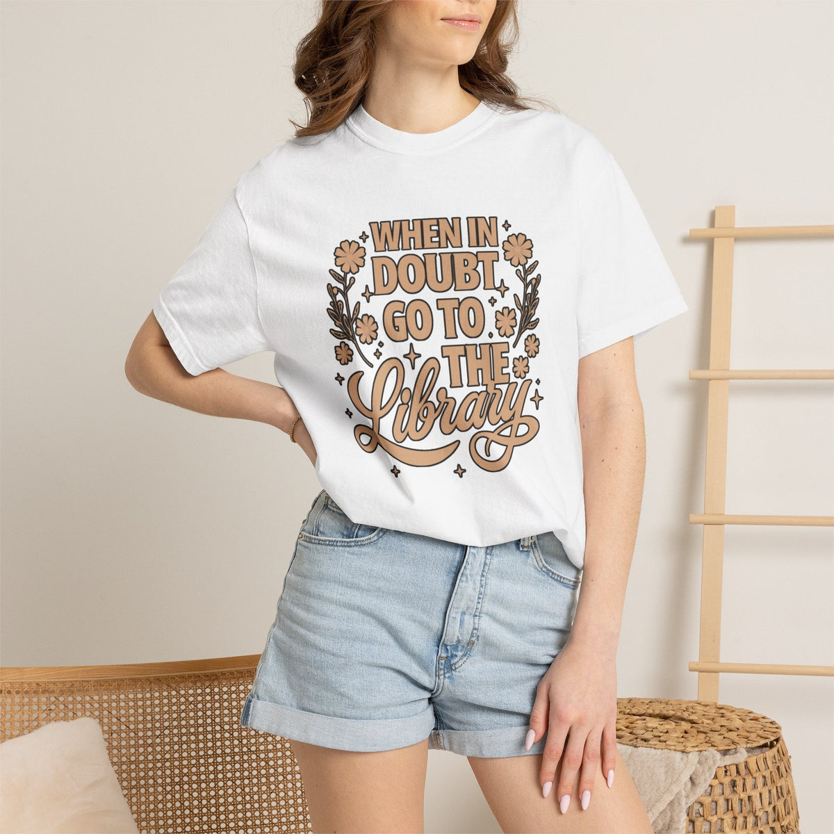 Wicked Thread Society white graphic tee with When in Doubt Go to the Library text, floral accents, and relaxed fit.