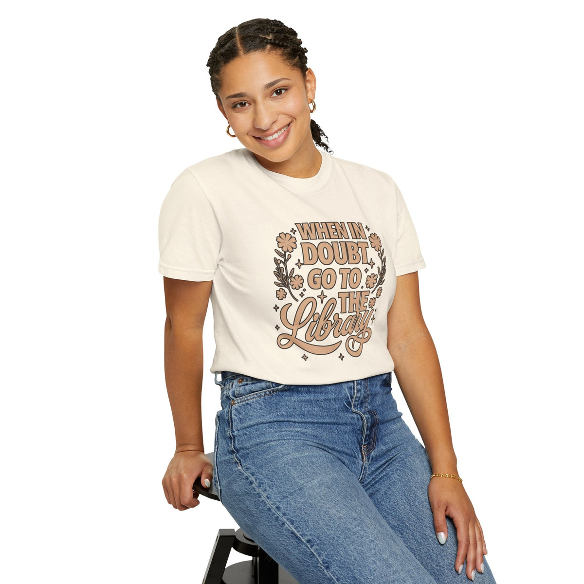 Wicked Thread Society cream graphic tee with When in Doubt Go to the Library text and floral art on a smiling model