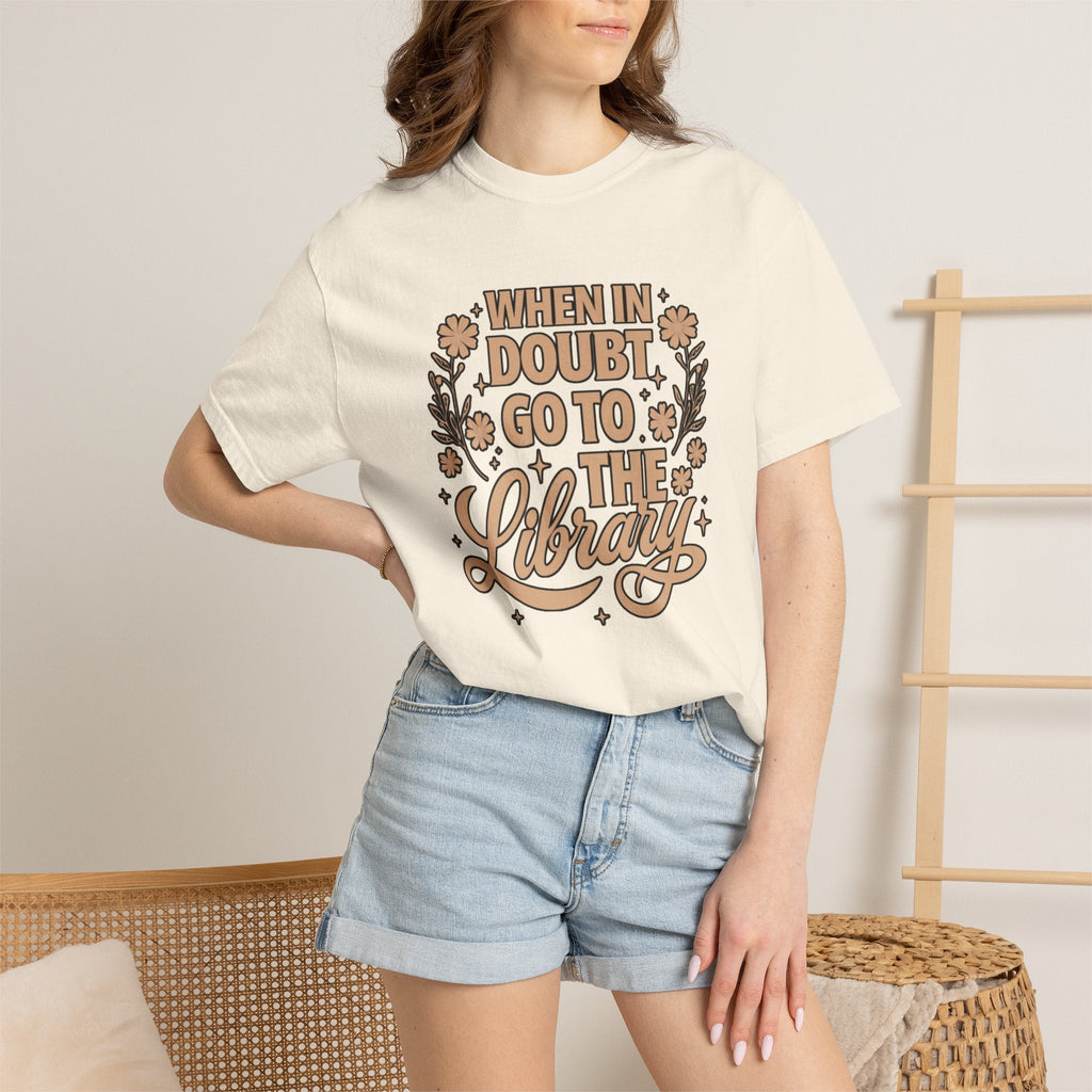 Wicked Thread Society cream graphic tee with When in Doubt Go to the Library text and floral details on a woman.