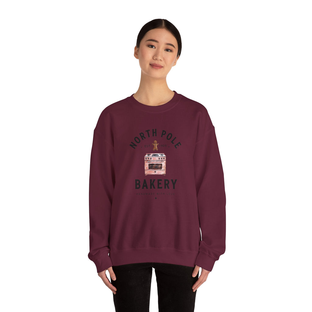 Wicked Thread Society maroon crewneck sweatshirt with a North Pole Bakery oven and gingerbread man graphic