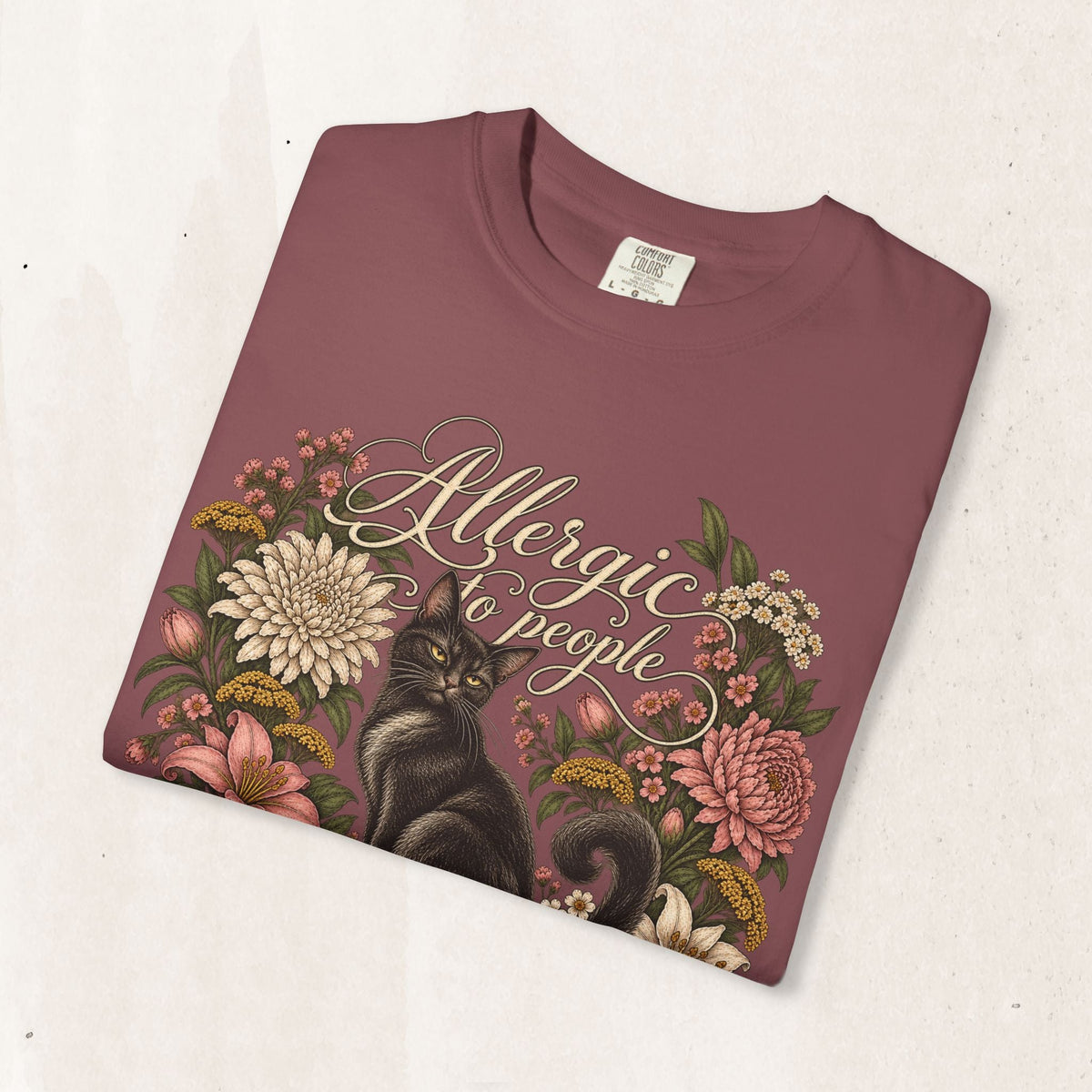 Wicked Thread Society maroon graphic tee featuring a black cat illustration surrounded by a vintage floral wreath.