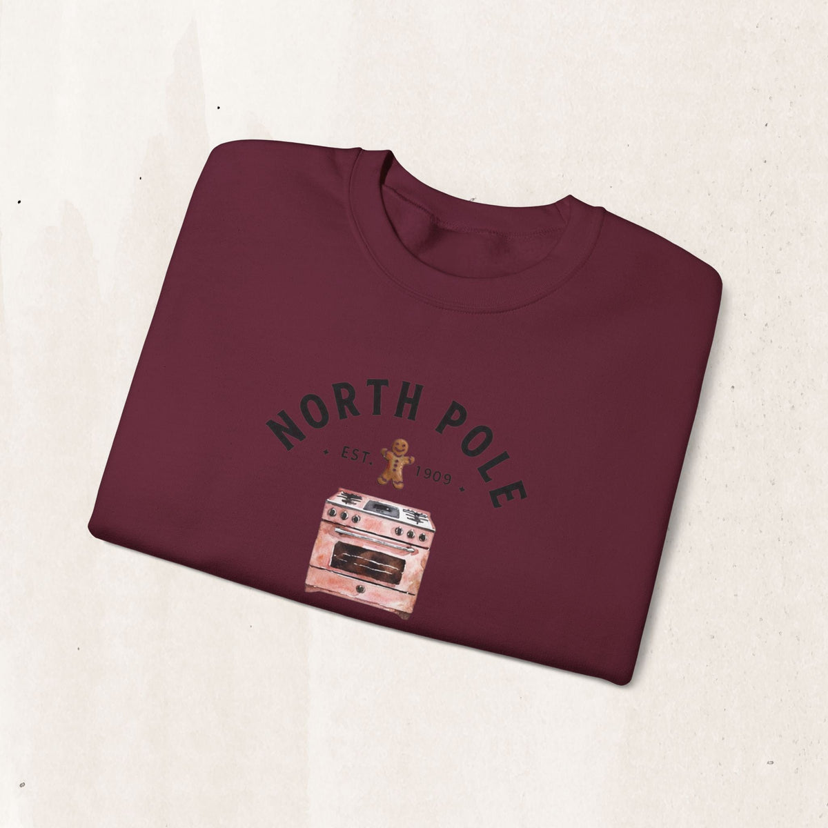 Wicked Thread Society maroon crewneck sweatshirt featuring a vintage North Pole Bakery oven and gingerbread man graphic