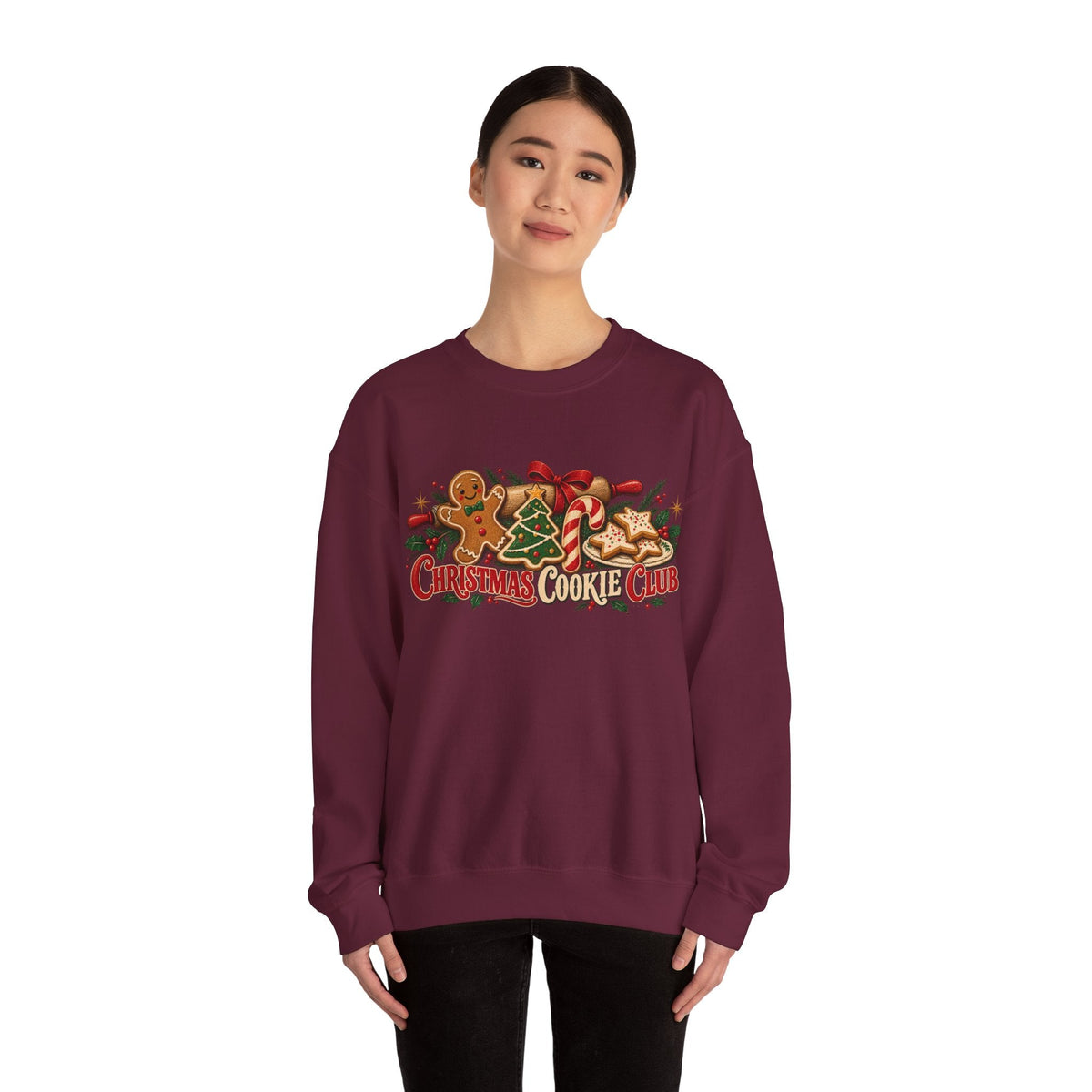 Wicked Thread Society maroon crewneck sweatshirt featuring a festive Christmas Cookie Club graphic on a model