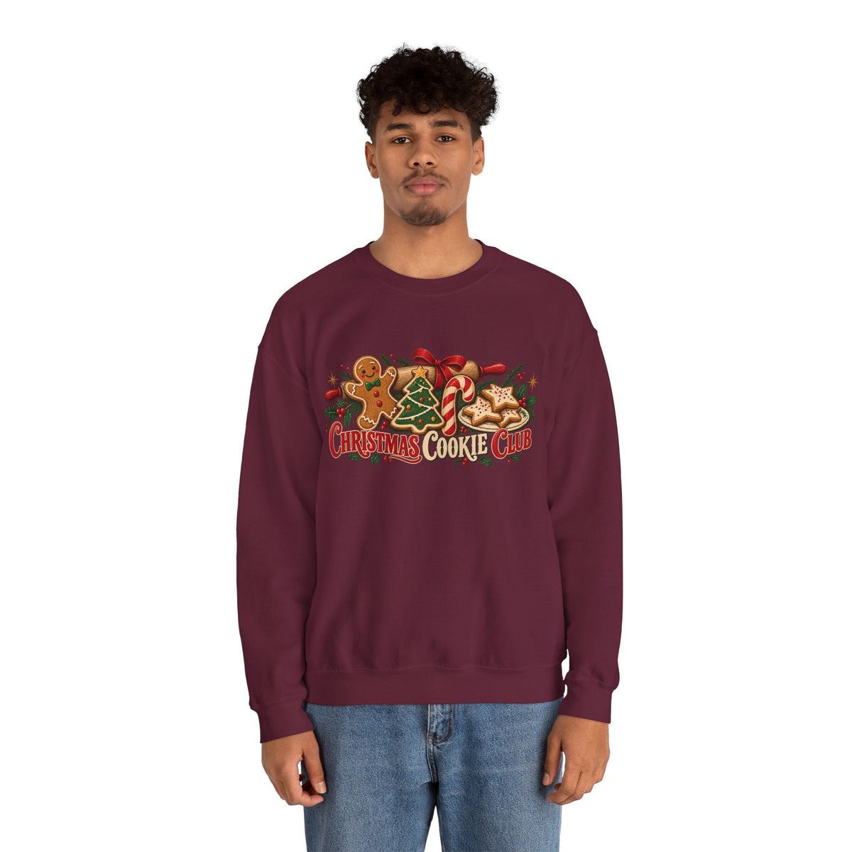 A man wearing a Wicked Thread Society maroon crewneck sweatshirt with a festive Christmas Cookie Club graphic print.
