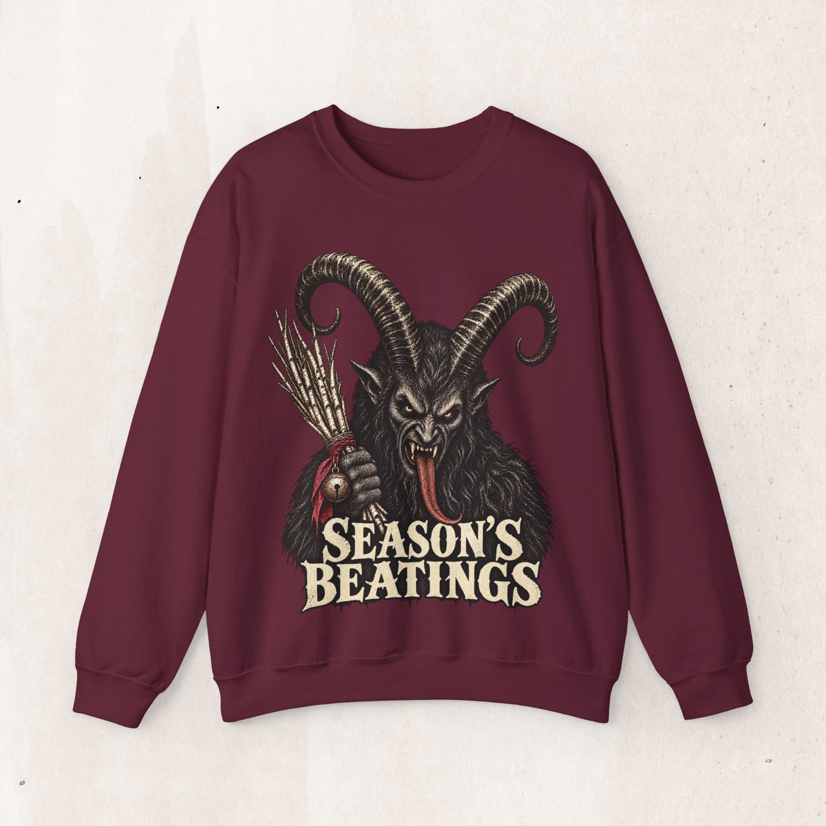 Wicked Thread Society maroon crewneck sweatshirt featuring a detailed Krampus illustration and Seasons Beatings text.