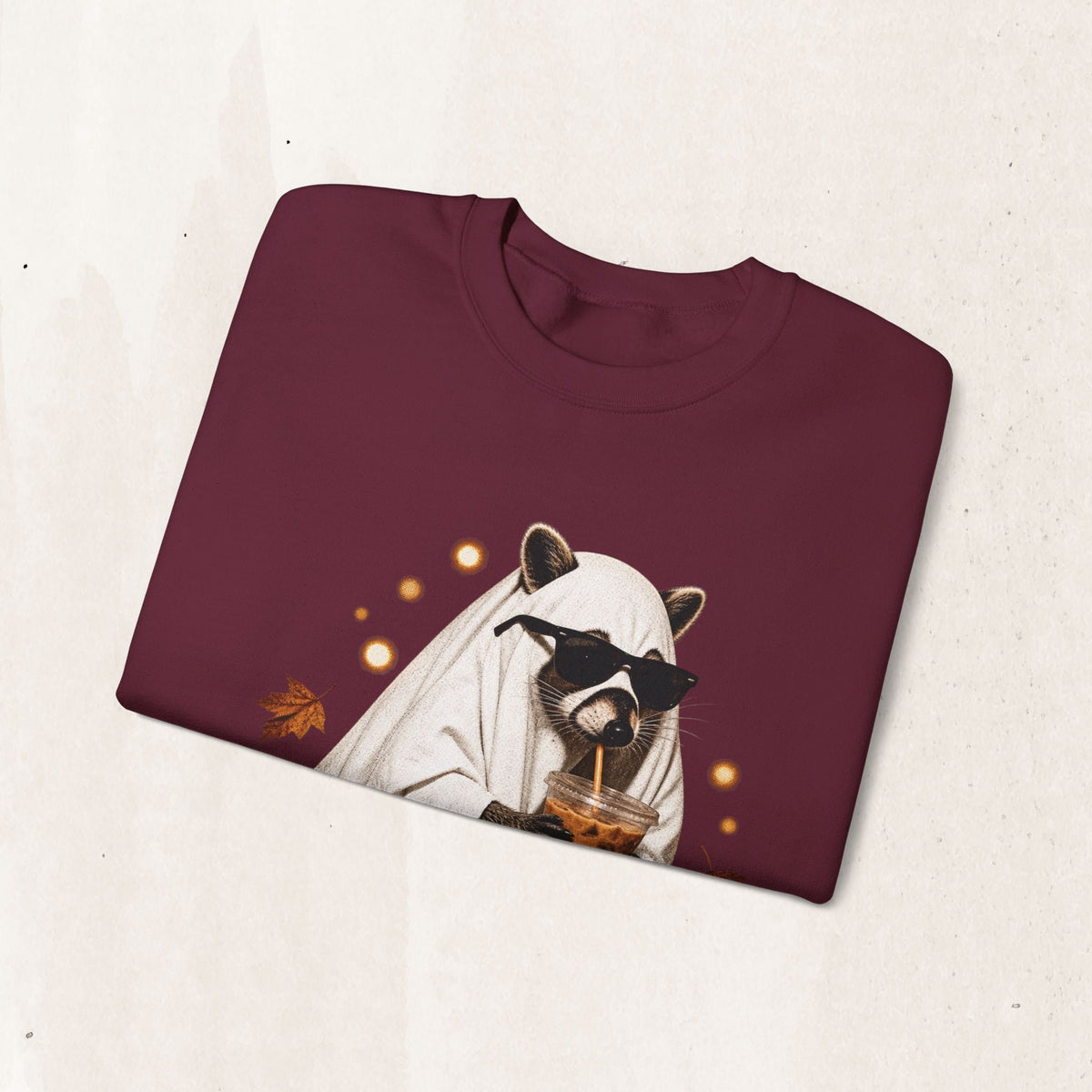 Wicked Thread Society maroon crewneck sweatshirt featuring a raccoon in a ghost costume drinking boba with sunglasses