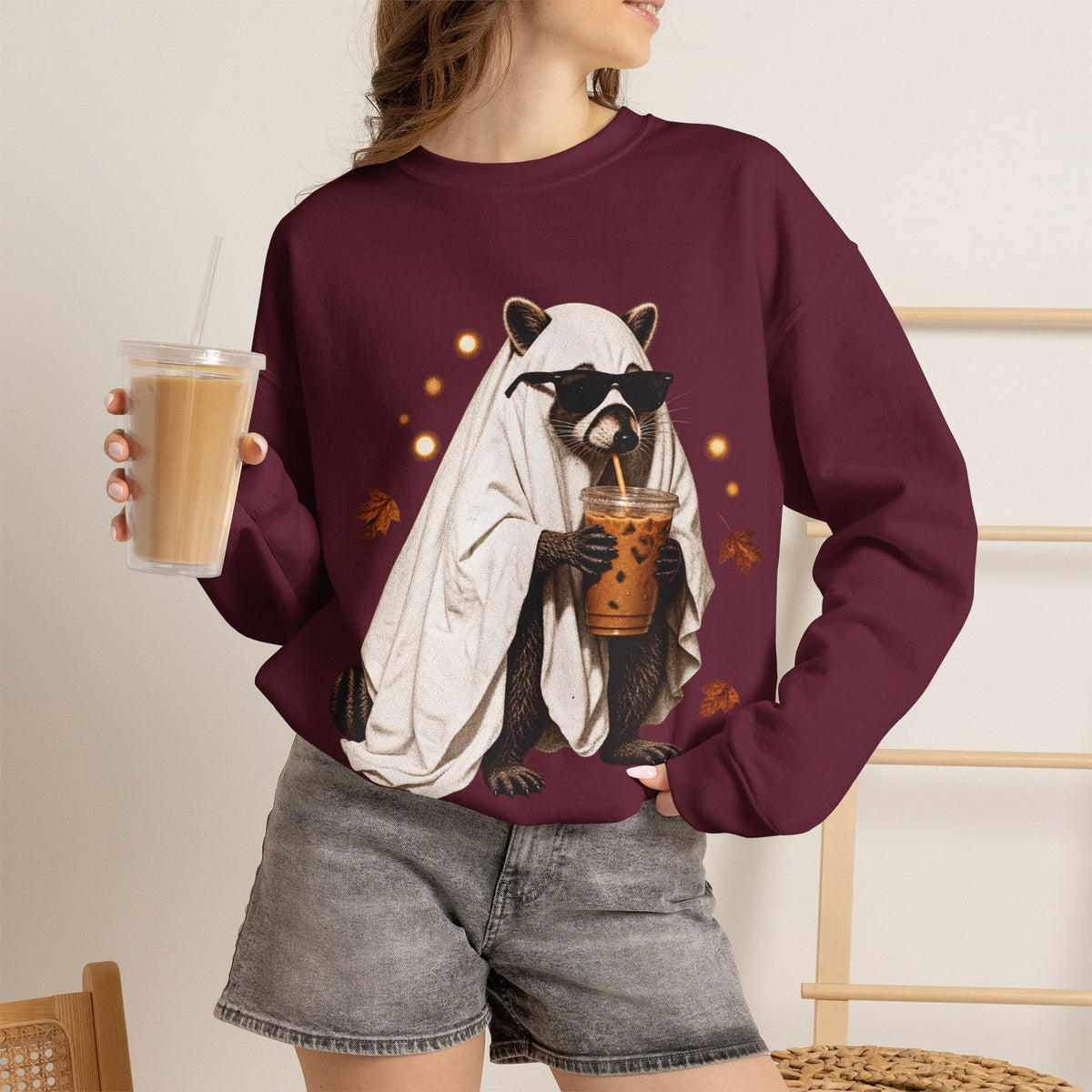 Wicked Thread Society maroon crewneck sweatshirt featuring a raccoon in a ghost costume drinking boba tea