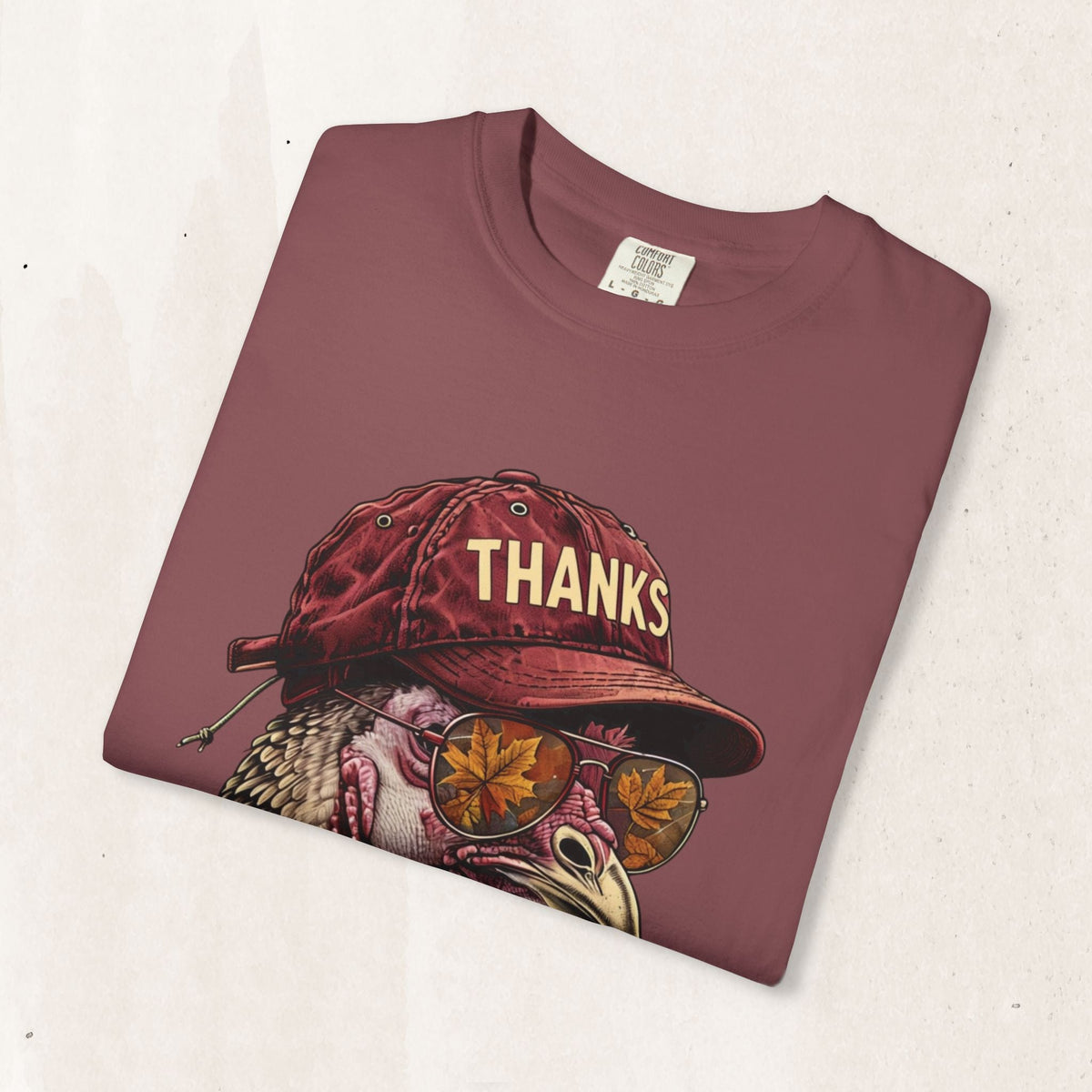 Wicked Thread Society maroon Thanksgiving t-shirt featuring a turkey wearing a baseball cap and sunglasses.
