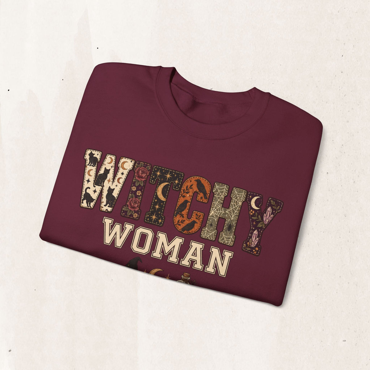 Wicked Thread Society maroon crewneck sweatshirt featuring a Witchy Woman graphic with mystical occult patterns.