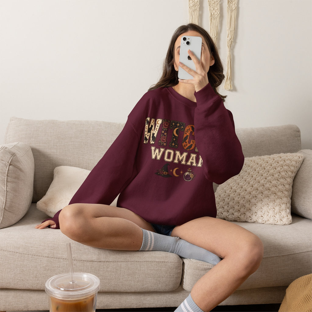 Wicked Thread Society maroon crewneck sweatshirt with Witchy Woman graphic print worn by a woman on a beige sofa.