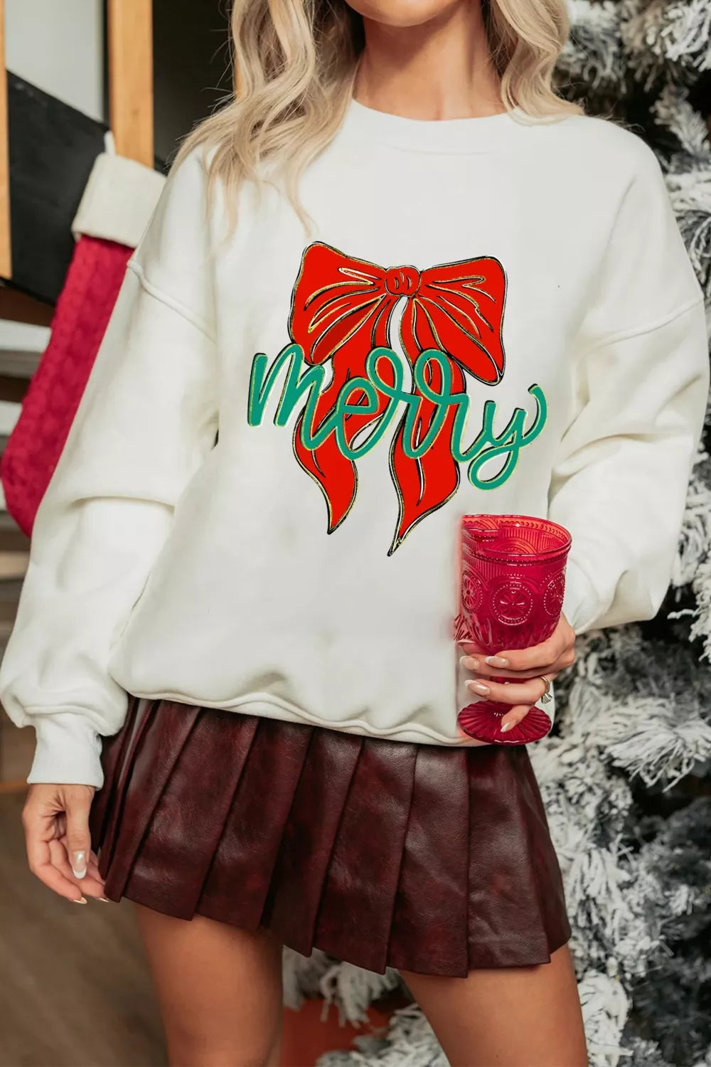 Wicked Thread Society white drop shoulder sweatshirt featuring a red bow and green merry graphic for Christmas